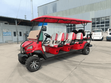 8-seater electric golf cart in red color parked in an outdoor facility with ample seating and modern design.